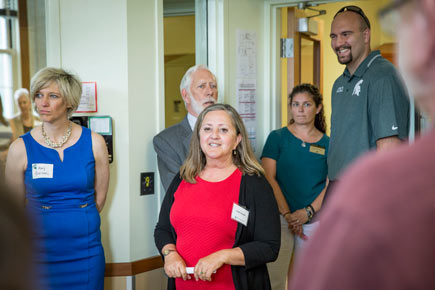 Laurie Linscott with donors for the institute in early August. 