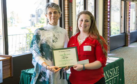 Ashley Triplett receiving her departmental award from Professor Deb Feltz.
