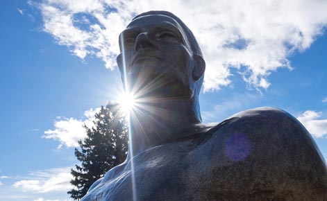 Sparty statue is shown with sunlight behind.