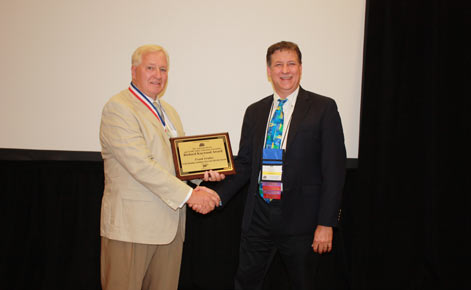 Frank Gruber, left, and ____ Van Tassel of AAA at the award ceremony