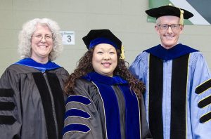 Marilyn Amey, Christina Yao and Roger Baldwin pose at graduation. 