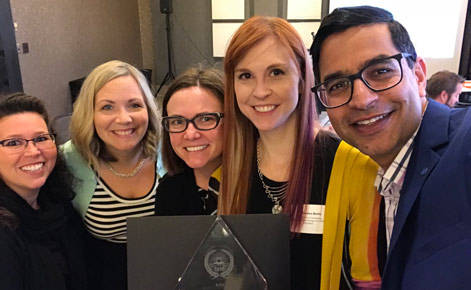 Representatives from MAET gathered to accept the award, including (from left to right): Candace Marcotte, Mary Wever, Leigh Graves Wolf, Liz Owens Boltz, Aman Yadav. 