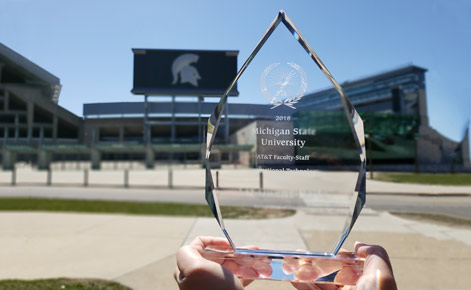 Award is shown in forefront of Spartan Stadium.