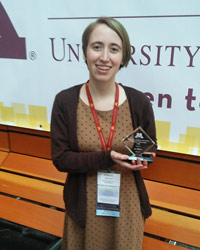 Tomlinson poses with her award at the Design of Medical Devices Conference in 2017. 