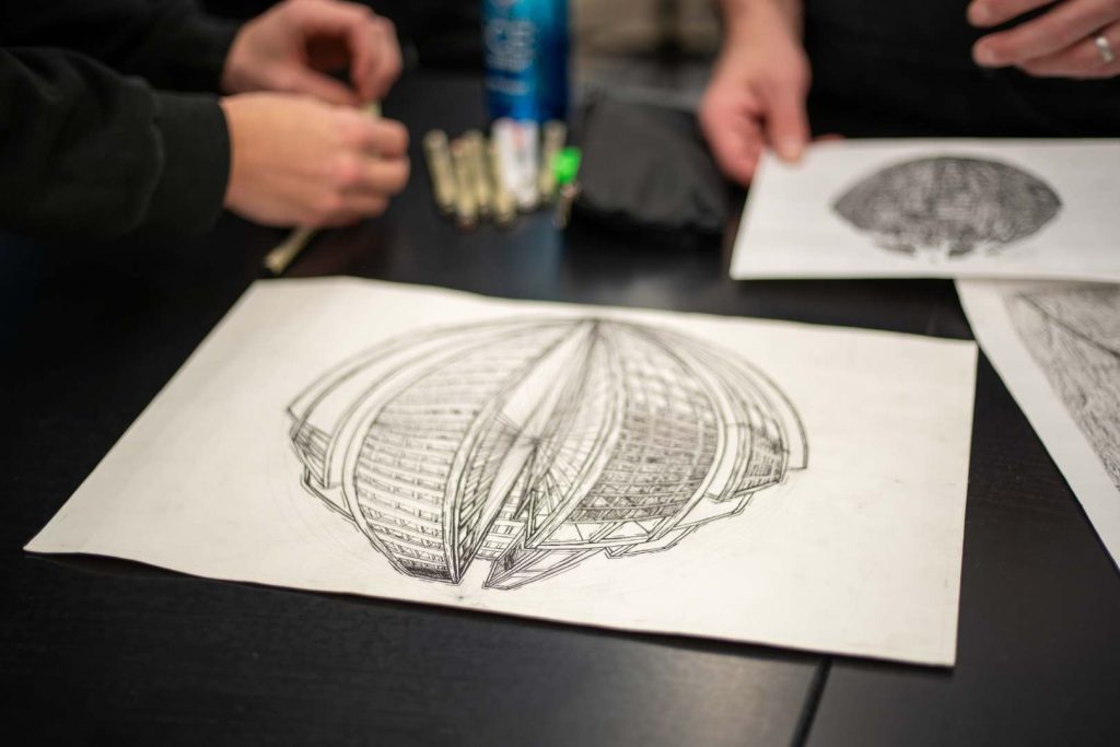 A drawing sits on a desk.