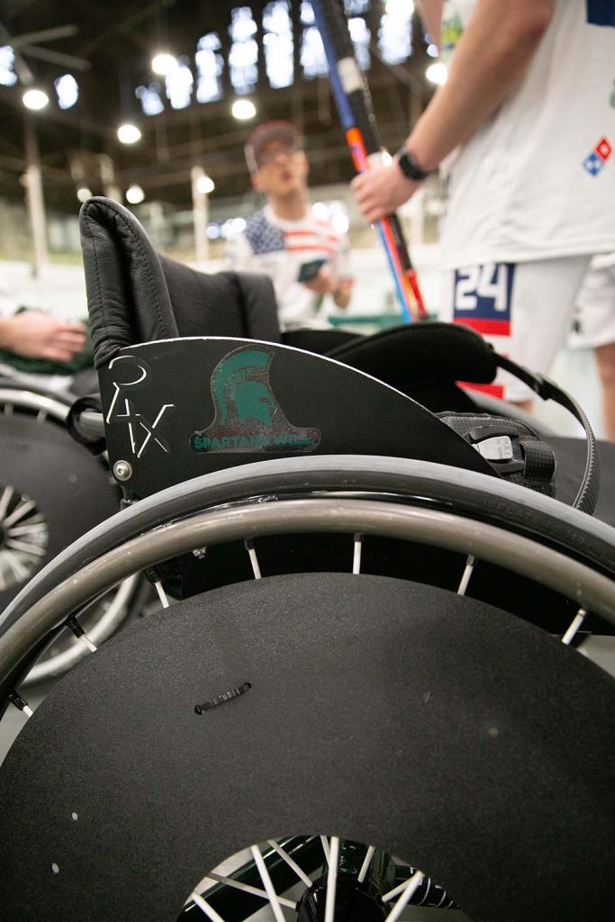A Spartan helmet is visible on a wheelchair.