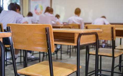 Classroom with students working at desks.