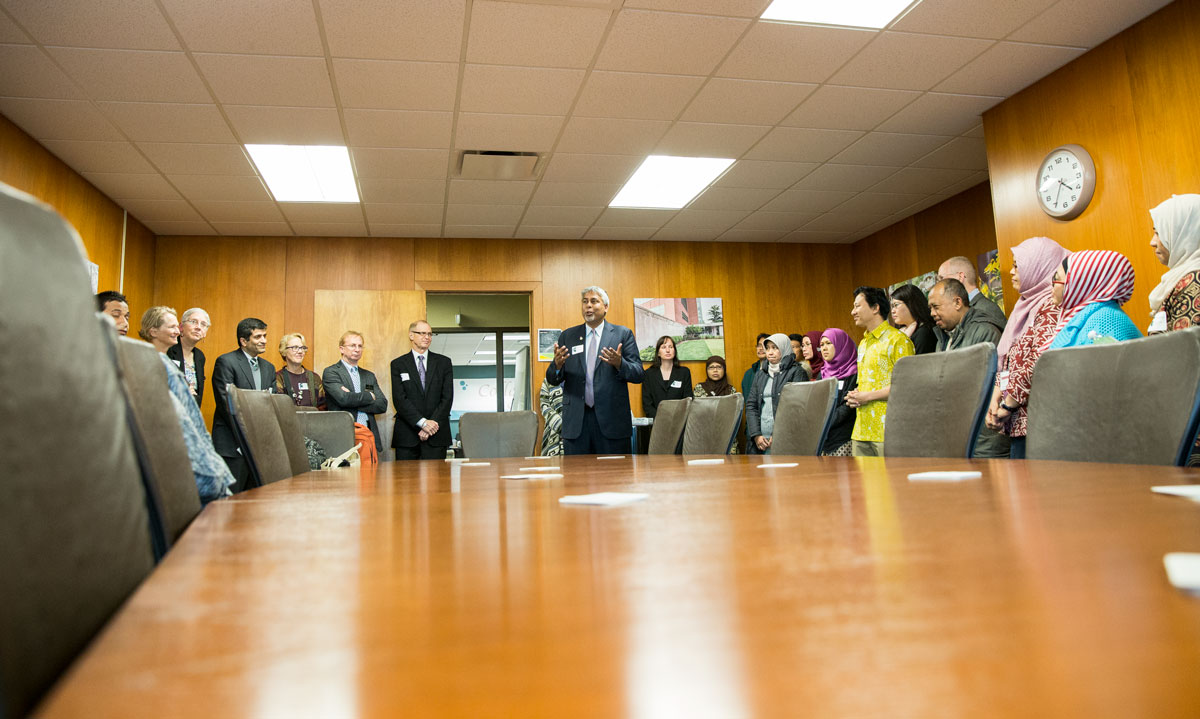 Michigan state representative Sam Singh talking to group of faculty, students, and Indonesian visitors