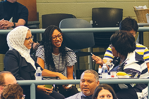 Students talking to professor