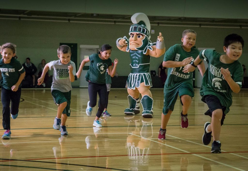 Sparty running with kids
